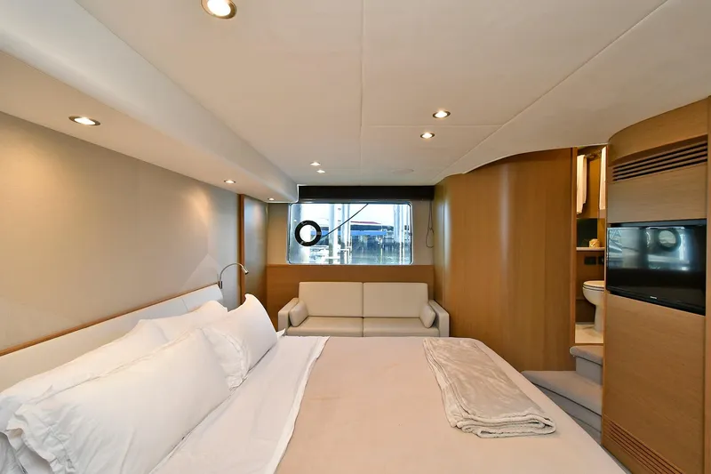 "about Time" Yacht Photos Pics Luxurious bedroom interior of 2016 Princess 52 Flybridge Yacht with modern design and cozy ambiance.
