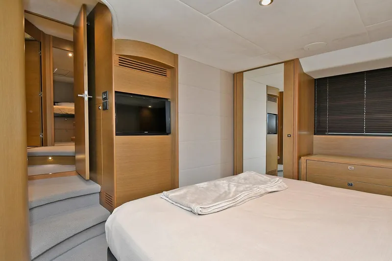 "about Time" Yacht Photos Pics Luxurious bedroom interior of 2016 Princess 52 Flybridge Yacht with modern design and amenities.