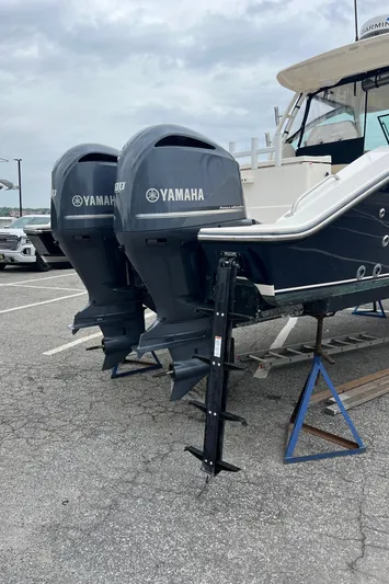 Hot Pursuit Yacht Photos Pics 2016 Pursuit 325 DC boat with dual Yamaha outboard engines on a trailer.