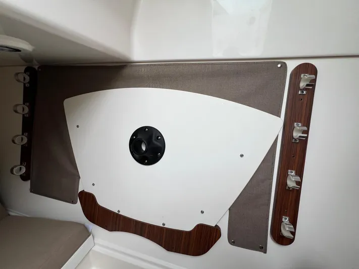 Hot Pursuit Yacht Photos Pics Interior detail of a 2016 Pursuit 325 DC boat, featuring storage and mounting fixtures.