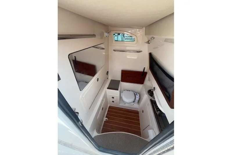  Yacht Photos Pics 2023 Grady-White Canyon 306 boat interior with compact bathroom amenities.
