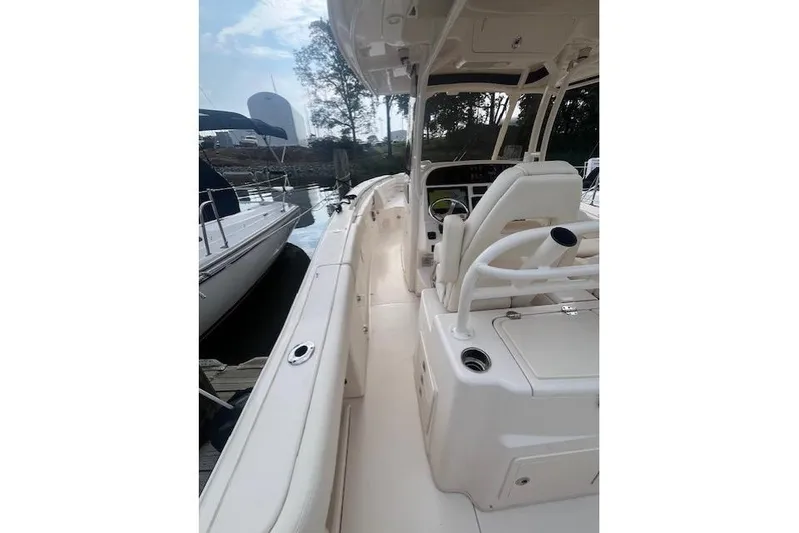  Yacht Photos Pics 2023 Grady-White Canyon 306 boat interior with helm and seating area.