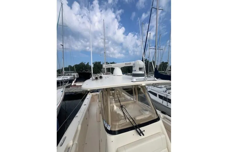  Yacht Photos Pics 2023 Grady-White Canyon 306 boat docked, featuring advanced navigation equipment.