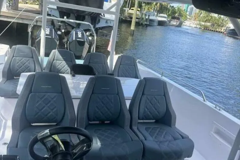 Milan Yacht Photos Pics 2024 Axopar 37 Sun Top boat interior with luxurious seating and dual engines.