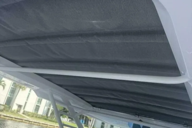 Milan Yacht Photos Pics 2024 Axopar 37 Sun Top boat canopy, showcasing sleek design and modern materials.