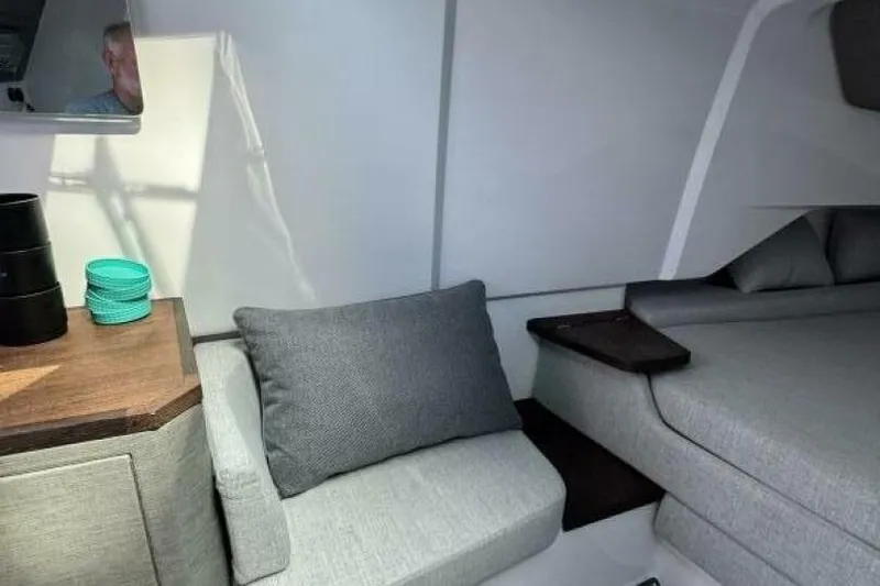 Milan Yacht Photos Pics Interior of 2024 Axopar 37 Sun Top, featuring modern seating and stylish decor.