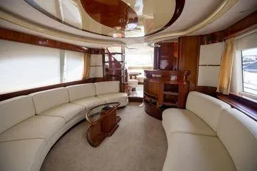 Ghost Rider Yacht Photos Pics Luxurious interior of 2003 Azimut 74 Solar yacht with elegant seating and modern design.