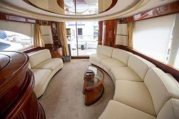 Ghost Rider Yacht Photos Pics Luxurious interior of 2003 Azimut 74 Solar yacht with elegant seating and wood finishes.