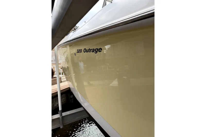 Yacht Photos Pics 2005 Boston Whaler 320 Outrage boat hull in docked position.
