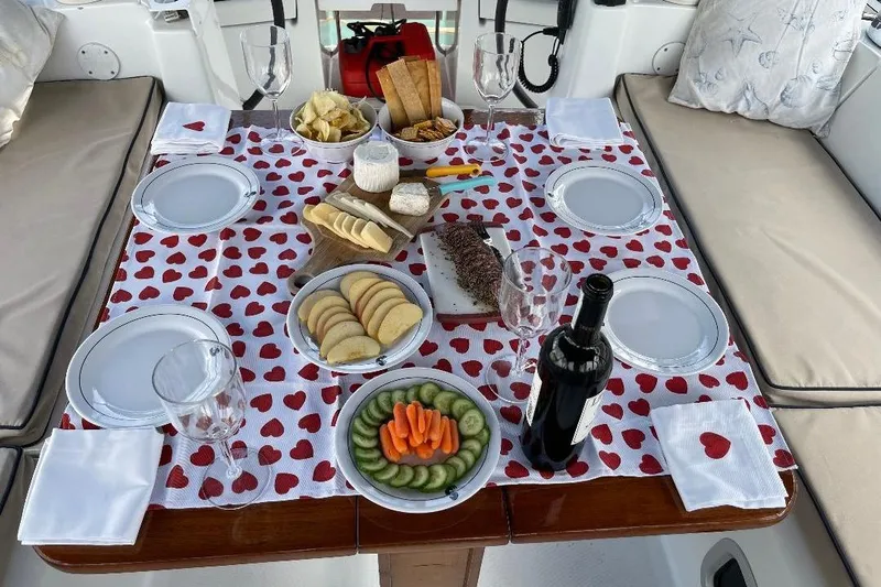 Sanctuary Yacht Photos Pics Romantic table setting on a 2005 Beneteau 473 yacht with snacks and wine.