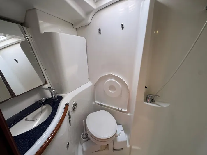 Sanctuary Yacht Photos Pics Bathroom interior of 2005 Beneteau Oceanis Clipper 473 yacht, featuring sink and toilet.