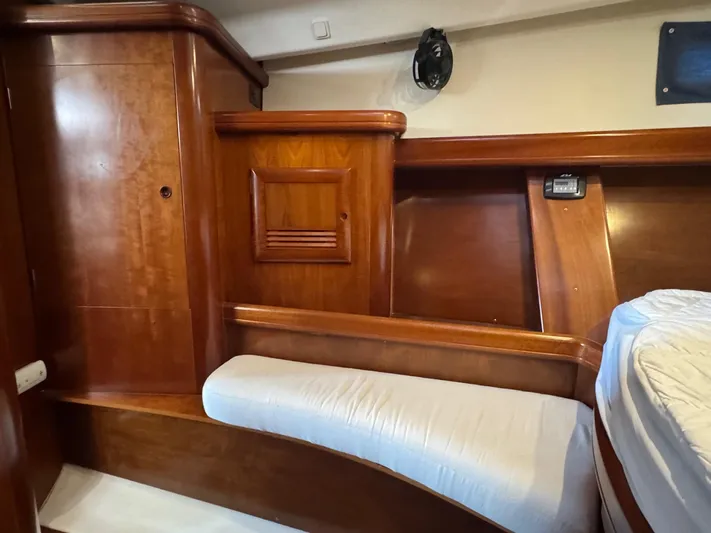 Sanctuary Yacht Photos Pics Interior of 2005 Beneteau Oceanis Clipper 473, featuring wooden cabinetry and seating.