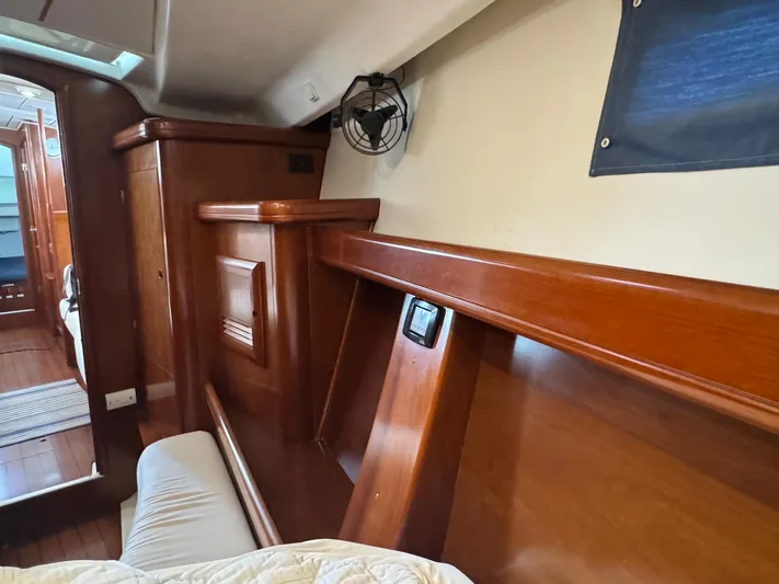 Sanctuary Yacht Photos Pics Interior of 2005 Beneteau Oceanis Clipper 473 yacht with wooden finish and cozy cabin.