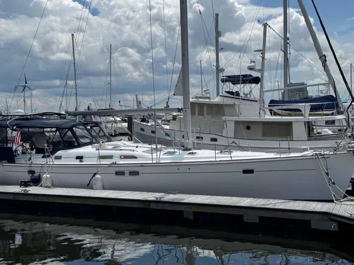 Sanctuary Yacht Photos Pics 2005 Beneteau Oceanis Clipper 473 sailboat docked at marina under cloudy sky.