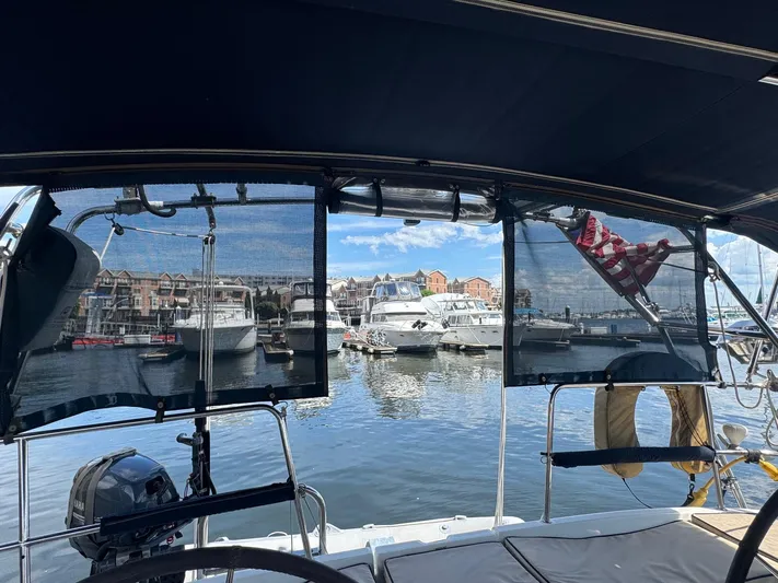 Sanctuary Yacht Photos Pics View from a 2005 Beneteau Oceanis Clipper 473, overlooking a marina with boats and buildings.