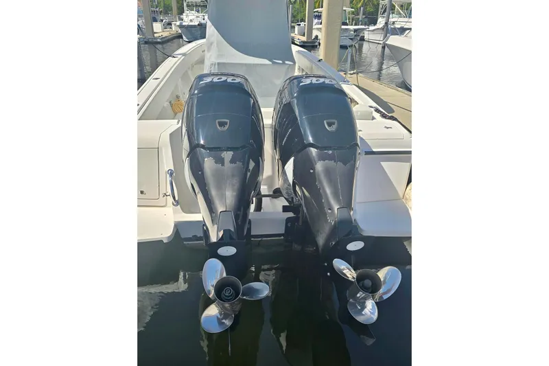  Yacht Photos Pics 2008 Intrepid 323 OPEN boat with dual outboard engines at a marina.