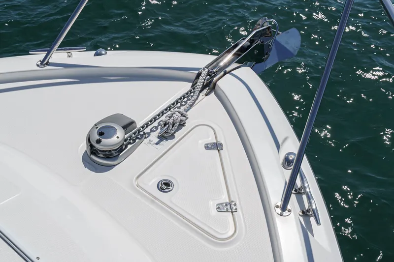 Slingshot Yacht Photos Pics 2018 Boston Whaler 315 Conquest boat anchor system on deck, with ocean background.