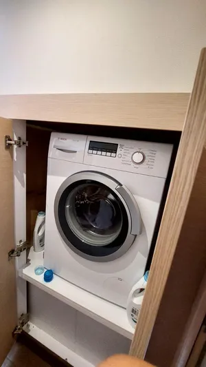  Yacht Photos Pics Washing machine in a cabinet on a 2018 Fountaine Pajot Saona 47 yacht.
