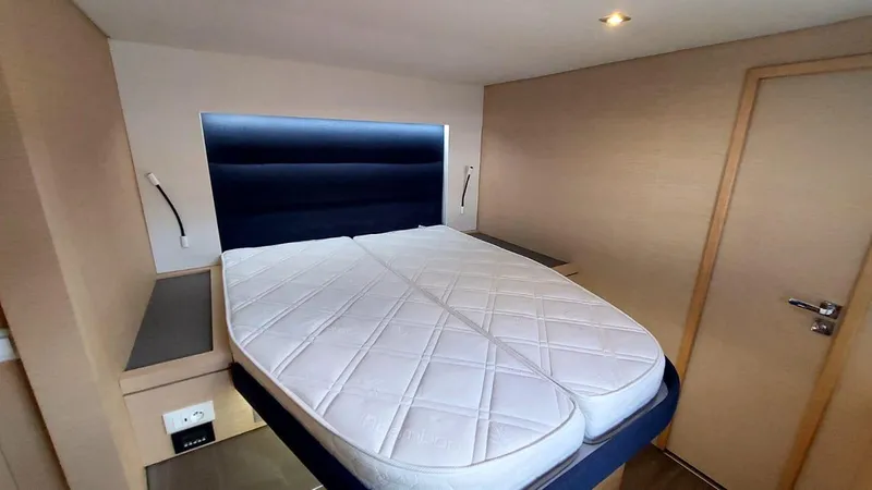 Yacht Photos Pics Interior cabin of 2018 Fountaine Pajot Saona 47 with modern bed design.