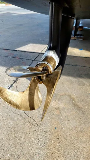  Yacht Photos Pics Close-up of a 2018 Fountaine Pajot Saona 47 propeller on a concrete surface.