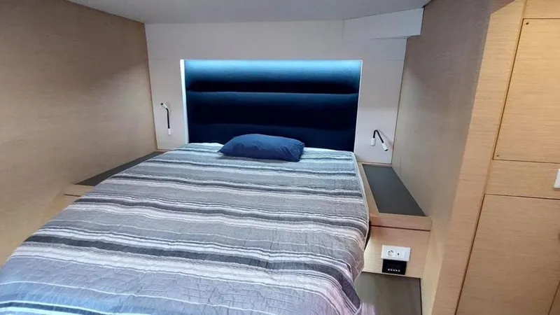  Yacht Photos Pics Interior cabin of 2018 Fountaine Pajot Saona 47 with cozy bed and modern design.