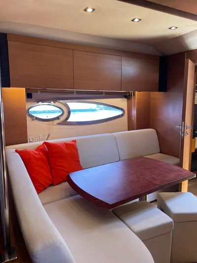  Yacht Photos Pics Interior of 2013 Azimut Atlantis 54 yacht with cozy seating and wooden table.
