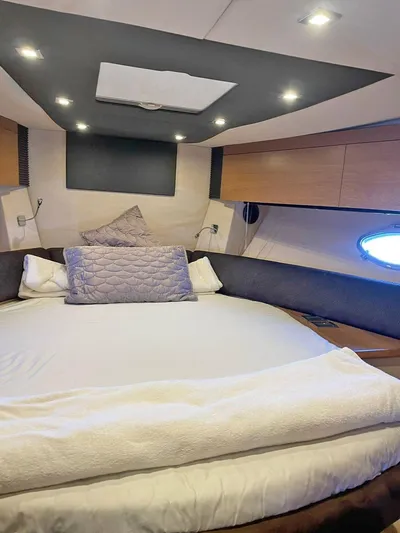  Yacht Photos Pics Luxurious bedroom interior of 2013 Azimut Atlantis 54 yacht with modern lighting.