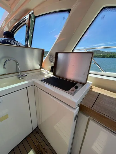  Yacht Photos Pics Interior view of 2013 Azimut Atlantis 54 yacht kitchen area.