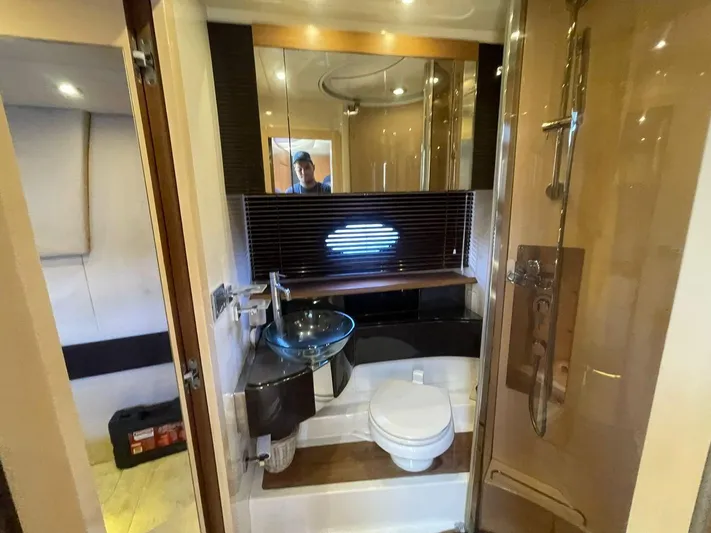  Yacht Photos Pics Luxurious bathroom in 2013 Azimut Atlantis 54 yacht with modern fixtures and glass sink.