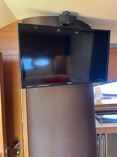  Yacht Photos Pics Flat-screen TV in the interior of a 2013 Azimut Atlantis 54 yacht.