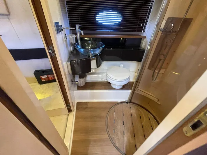  Yacht Photos Pics 2013 Azimut Atlantis 54 yacht bathroom with modern fixtures and wooden flooring.