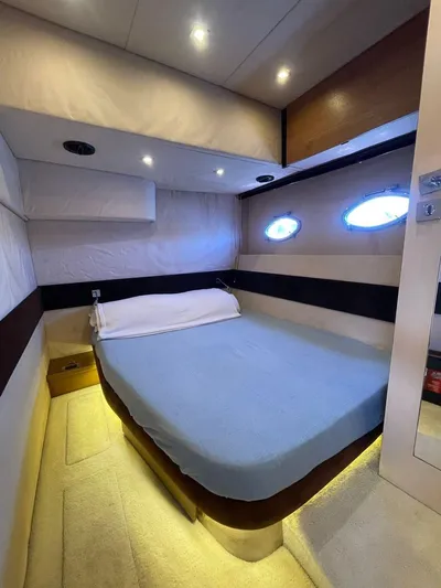  Yacht Photos Pics Luxurious bedroom interior of 2013 Azimut Atlantis 54 yacht with modern lighting.