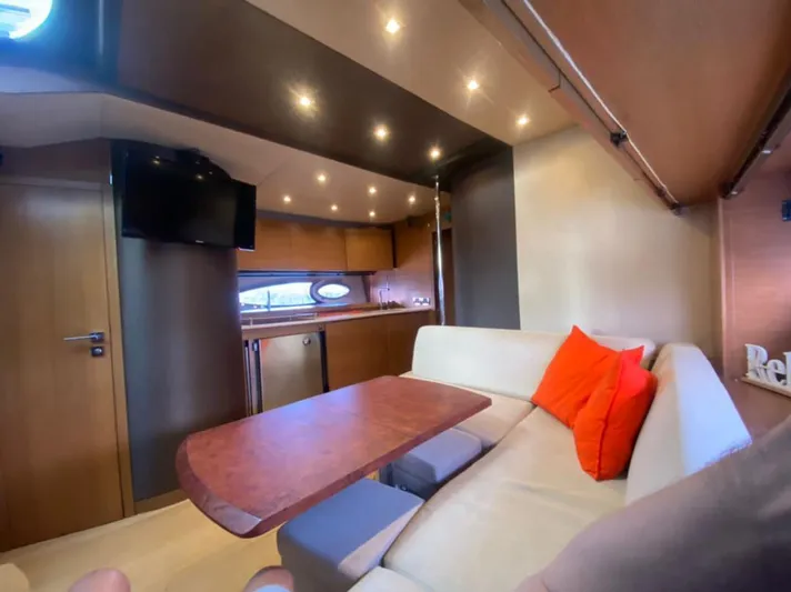  Yacht Photos Pics Luxurious interior of 2013 Azimut Atlantis 54 yacht with modern kitchen and cozy seating area.