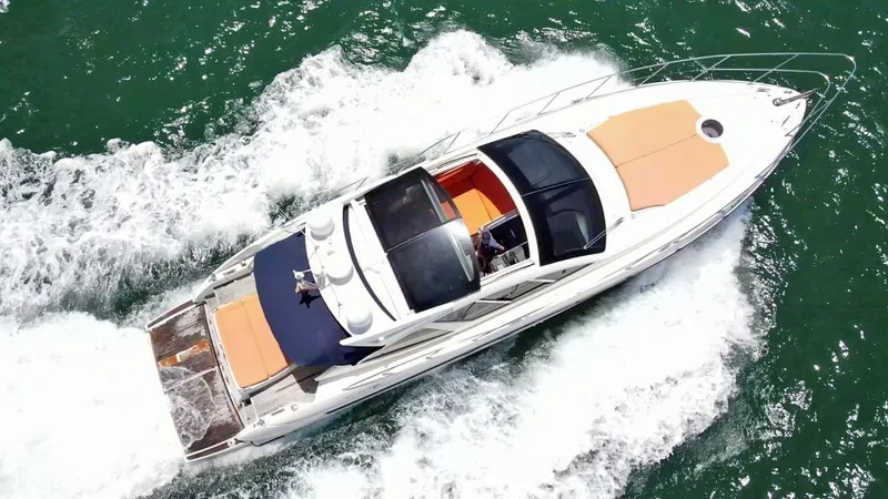  Yacht Photos Pics Aerial view of 2013 Azimut Atlantis 54 yacht cruising on the water.