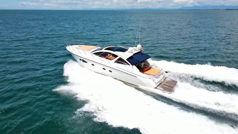  Yacht Photos Pics 2013 Azimut Atlantis 54 luxury yacht cruising on open water.