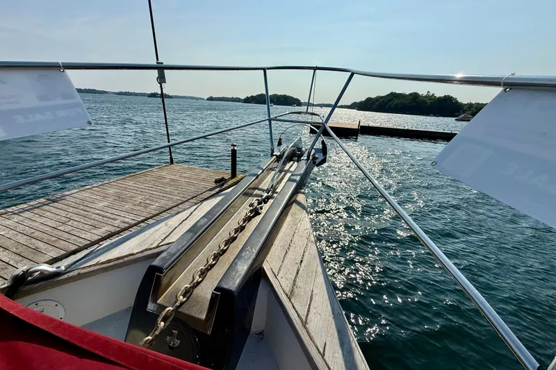  Yacht Photos Pics Bow view of a 1994 Custom 60 Trawler docked on a sunny day.