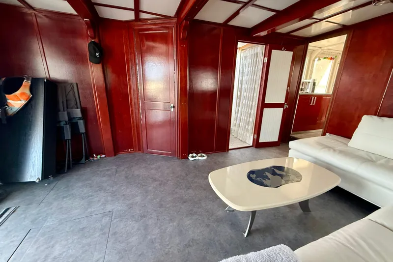  Yacht Photos Pics Interior of 1994 Custom 60 Trawler with wood paneling and modern furnishings.