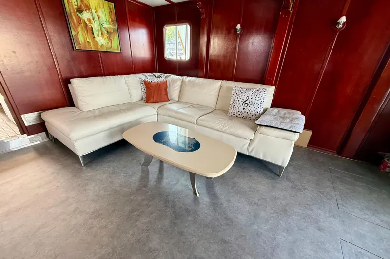  Yacht Photos Pics Luxurious interior of a 1994 Custom 60 Trawler with white sectional sofa and modern decor.