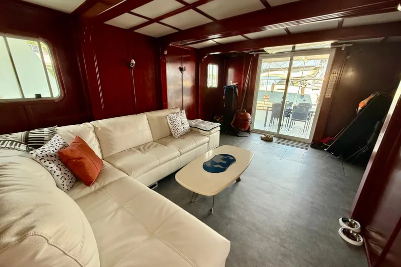  Yacht Photos Pics Luxurious interior of a 1994 Custom 60 Trawler with white sofa and modern decor.
