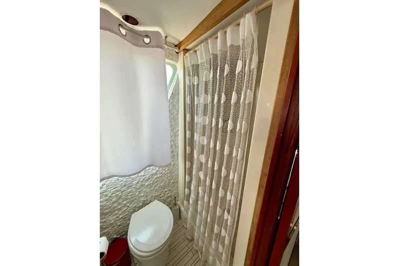  Yacht Photos Pics Bathroom interior of 1994 Custom 60 Trawler with shower and toilet.