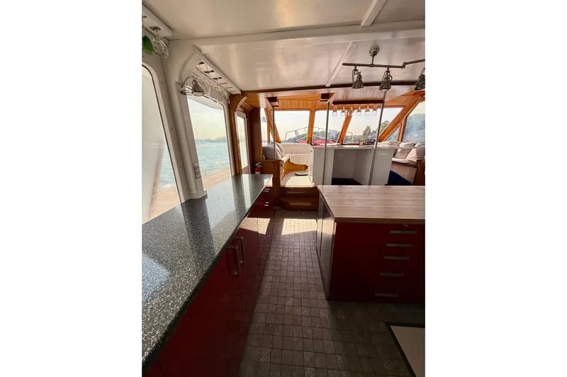  Yacht Photos Pics Interior of a 1994 Custom 60 Trawler with modern kitchen and seating area.