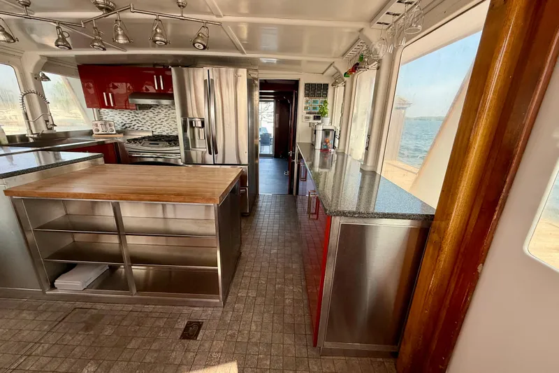  Yacht Photos Pics Luxurious 1994 Custom 60 Trawler kitchen with modern appliances and ocean view.