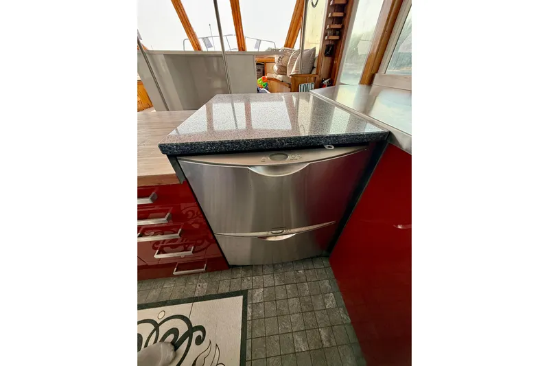  Yacht Photos Pics Stainless steel dishwasher in a 1994 Custom 60 Trawler kitchen interior.