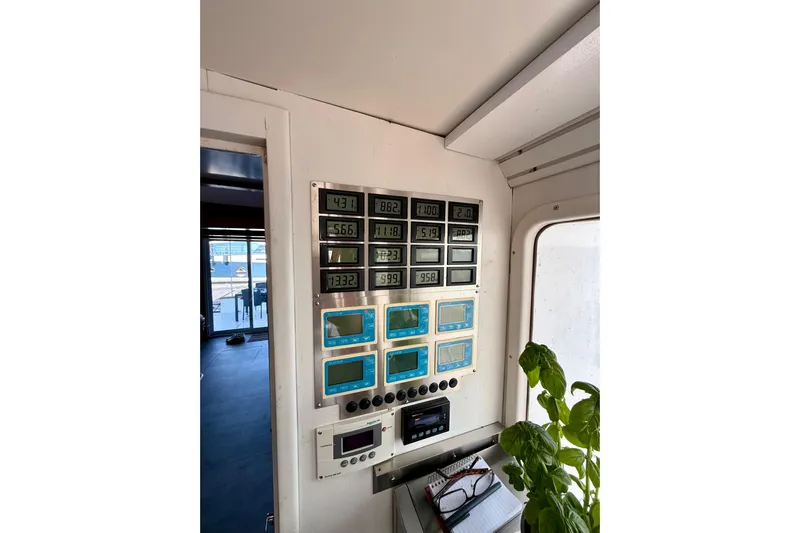  Yacht Photos Pics Control panel inside a 1994 Custom 60 Trawler, featuring multiple digital displays and gauges.