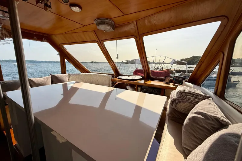  Yacht Photos Pics Interior of 1994 Custom 60 Trawler with panoramic windows and cozy seating.