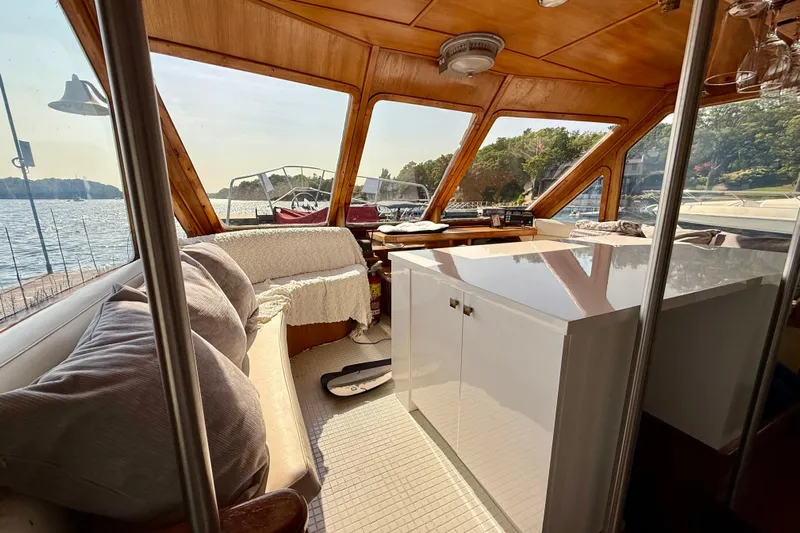  Yacht Photos Pics Interior of 1994 Custom 60 Trawler with cozy seating and panoramic windows.