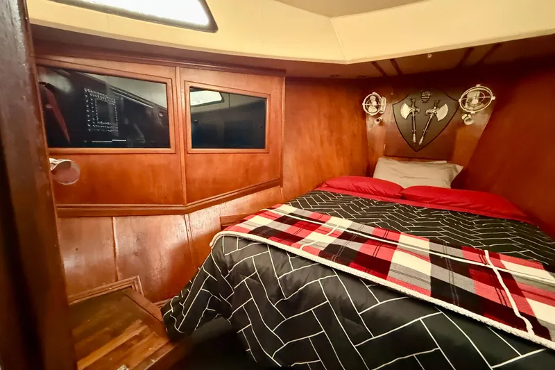  Yacht Photos Pics Cozy cabin interior of 1994 Custom 60 Trawler with wood paneling and decorative accents.