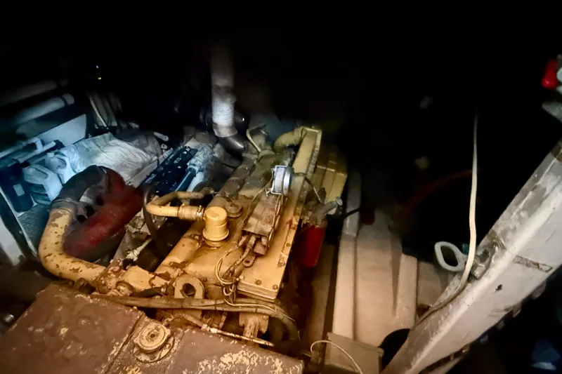 Yacht Photos Pics Engine room of a 1994 Custom 60 Trawler, showcasing machinery and components.