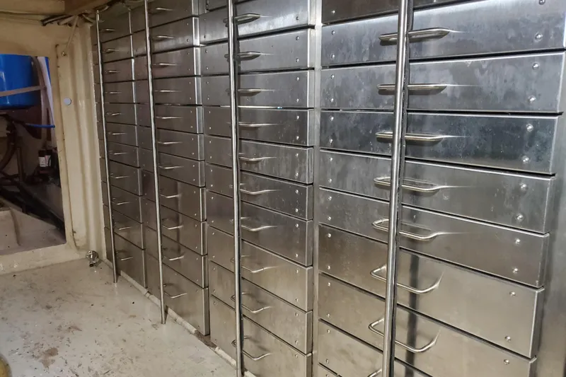  Yacht Photos Pics Metal storage drawers inside a 1994 Custom 60 Trawler boat.