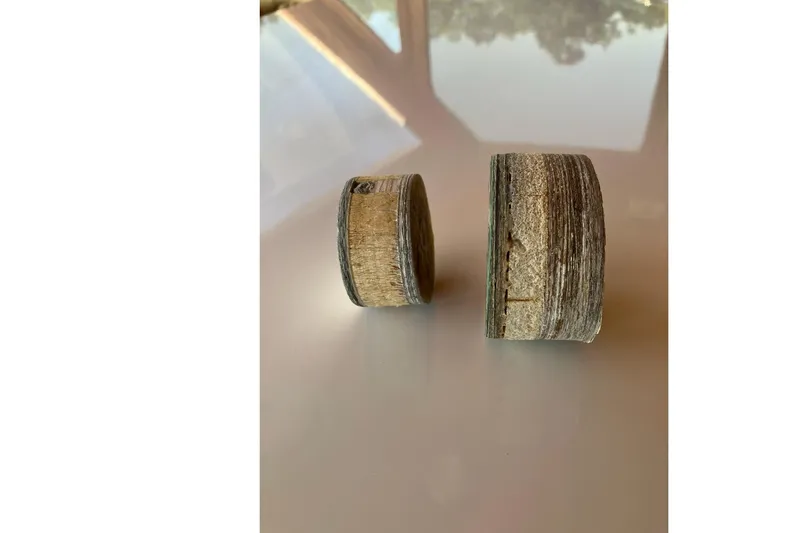  Yacht Photos Pics Two worn cylindrical components from a 1994 Custom 60 Trawler boat.